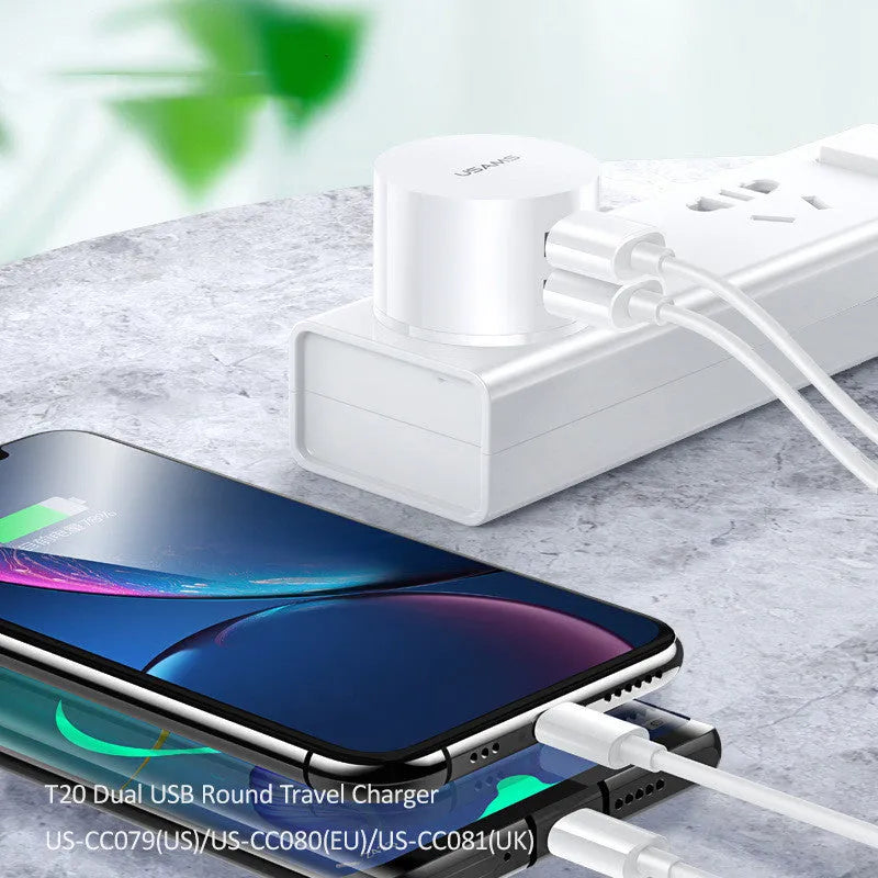 White portable universal dual USB phone charger with US, EU, and UK plug types.