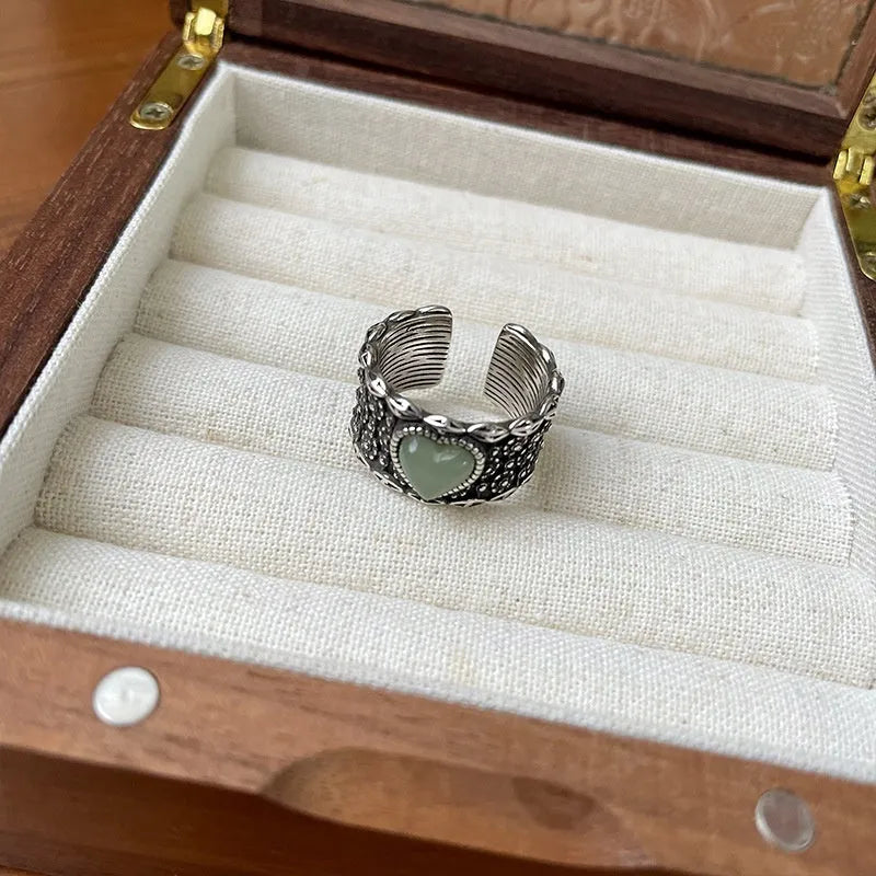 Retro style adjustable silver ring with a large heart shape and moon design in white or green colour.