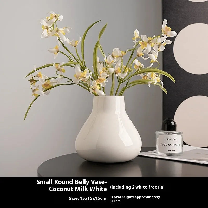 Round belly ceramic vase in black or white with optional artificial flowers arrangement