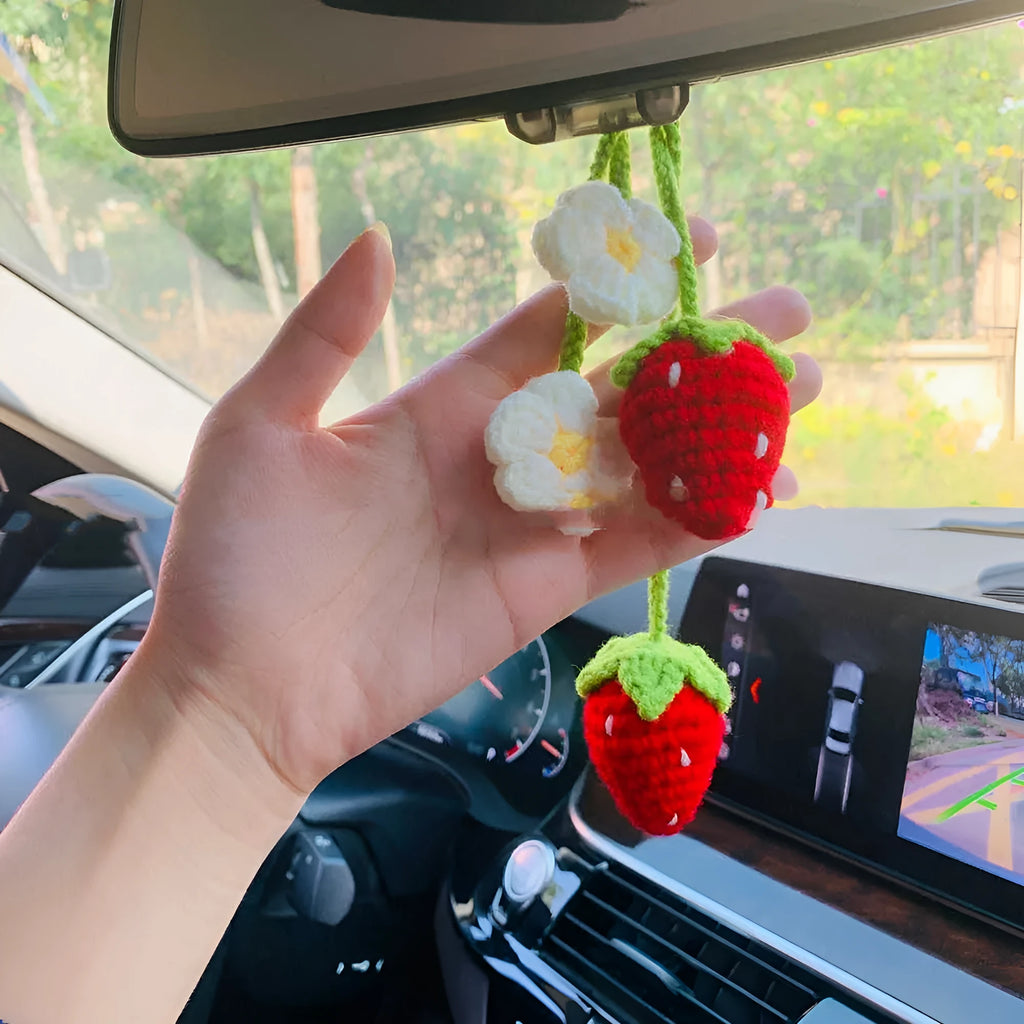 Handmade strawberry-shaped car pendant knitted from cotton and hemp wool.