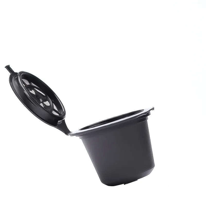 Six recyclable coffee shell filter cups in black, brown, and red plastic with a spoon