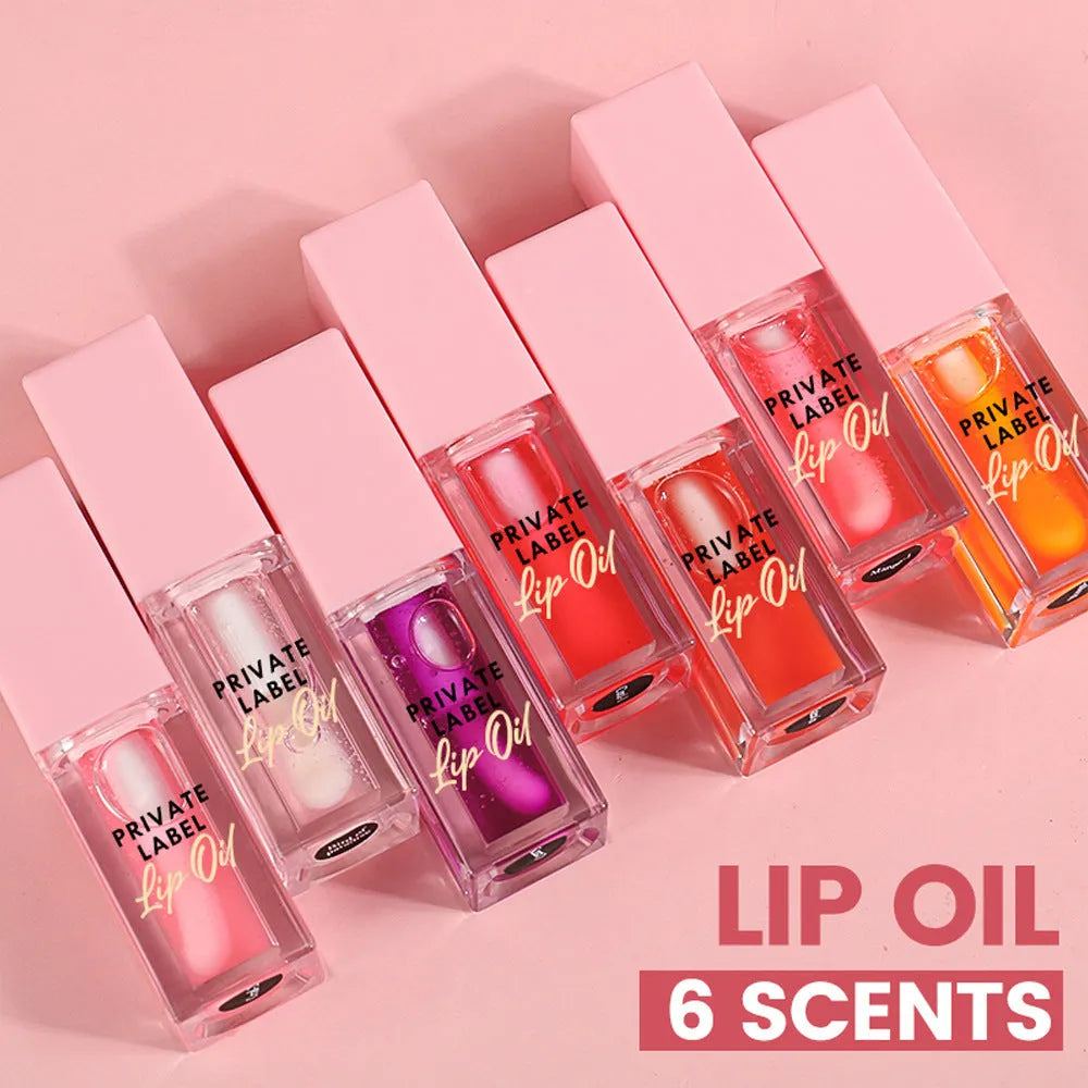 Set of six transparent lip gloss tubes in fruity flavours including cherry and watermelon