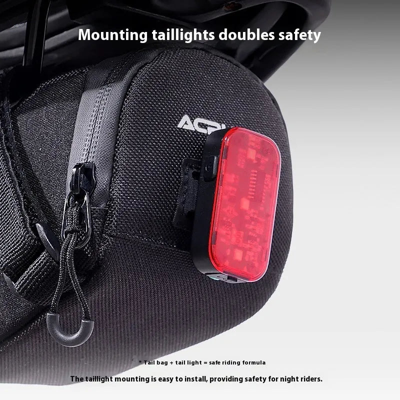 Bicycle waterproof rear bag with hanging taillight in black, 15x8x8cm, 1.5L capacity, composite fabric and mesh construction