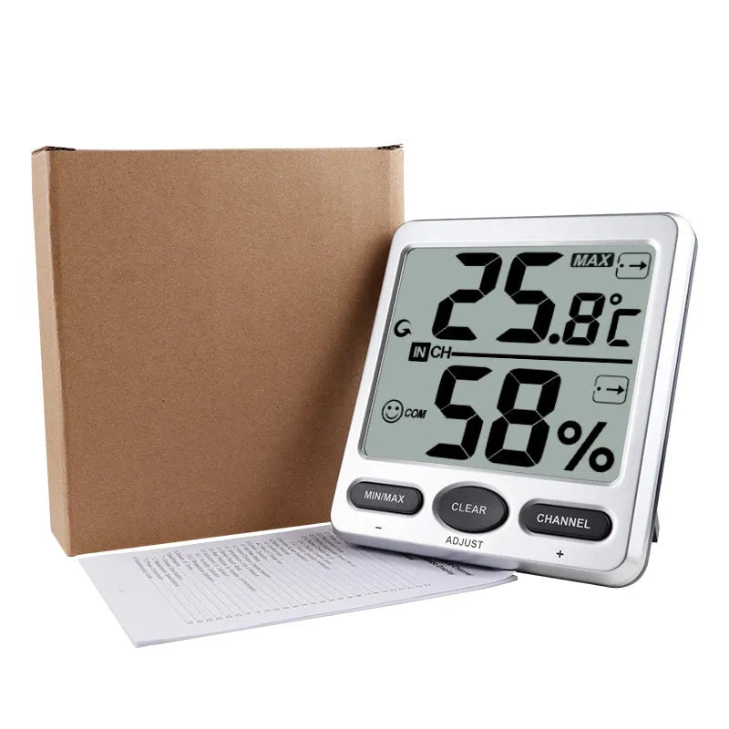 Silver electronic digital thermometer with humidity display for wall mounting in living room or baby room