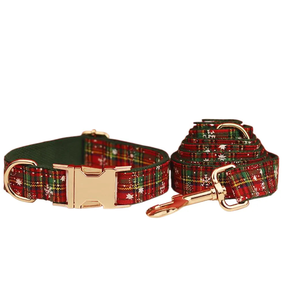 Green snowflake Christmas pet collar set with matching dog leash, bow decoration and vest in four-piece bundle