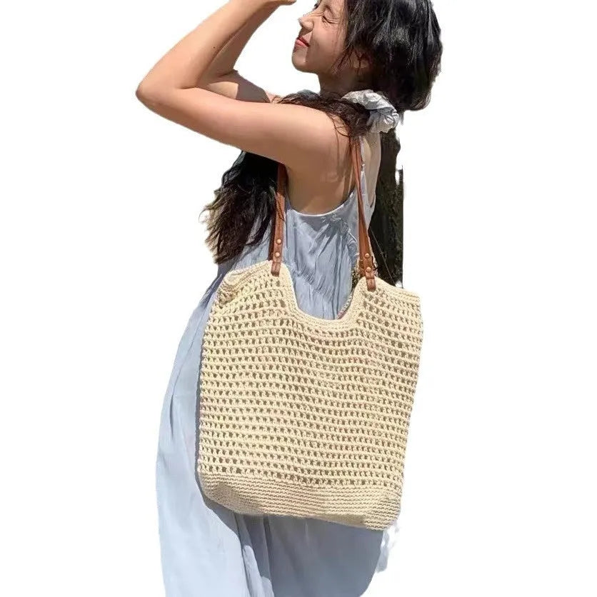 Beige woven cotton linen shoulder bag with spacious interior for beach holidays