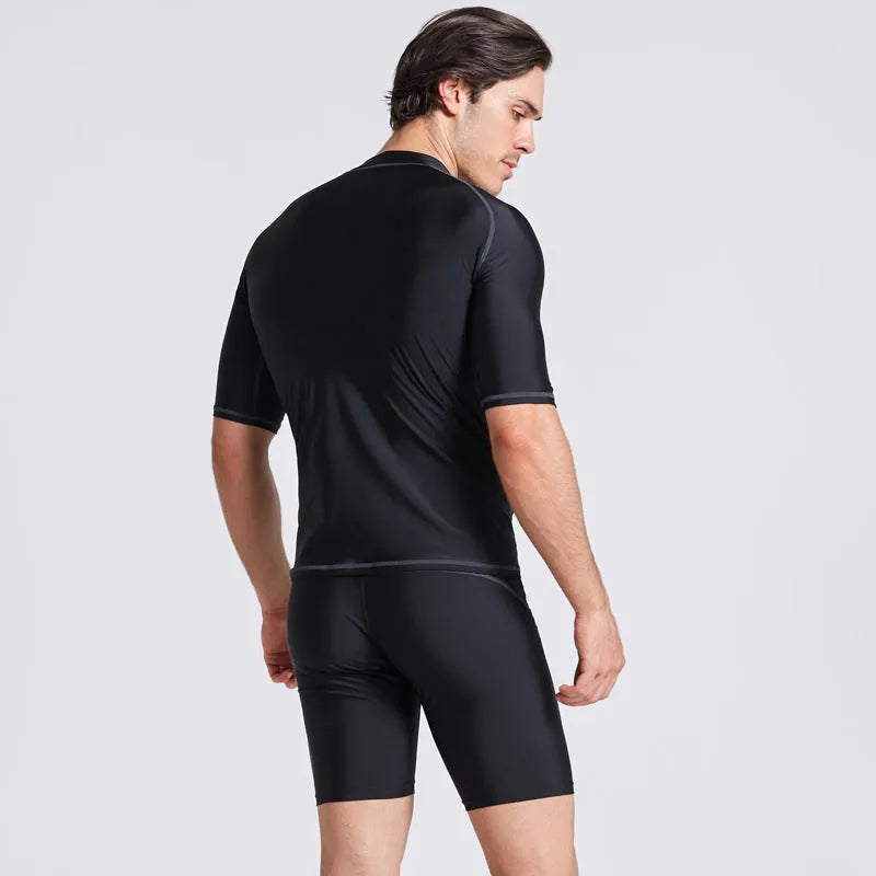 Men's quick-dry half sleeve swimsuit suit for snorkelling, showing separate nylon top and pants.