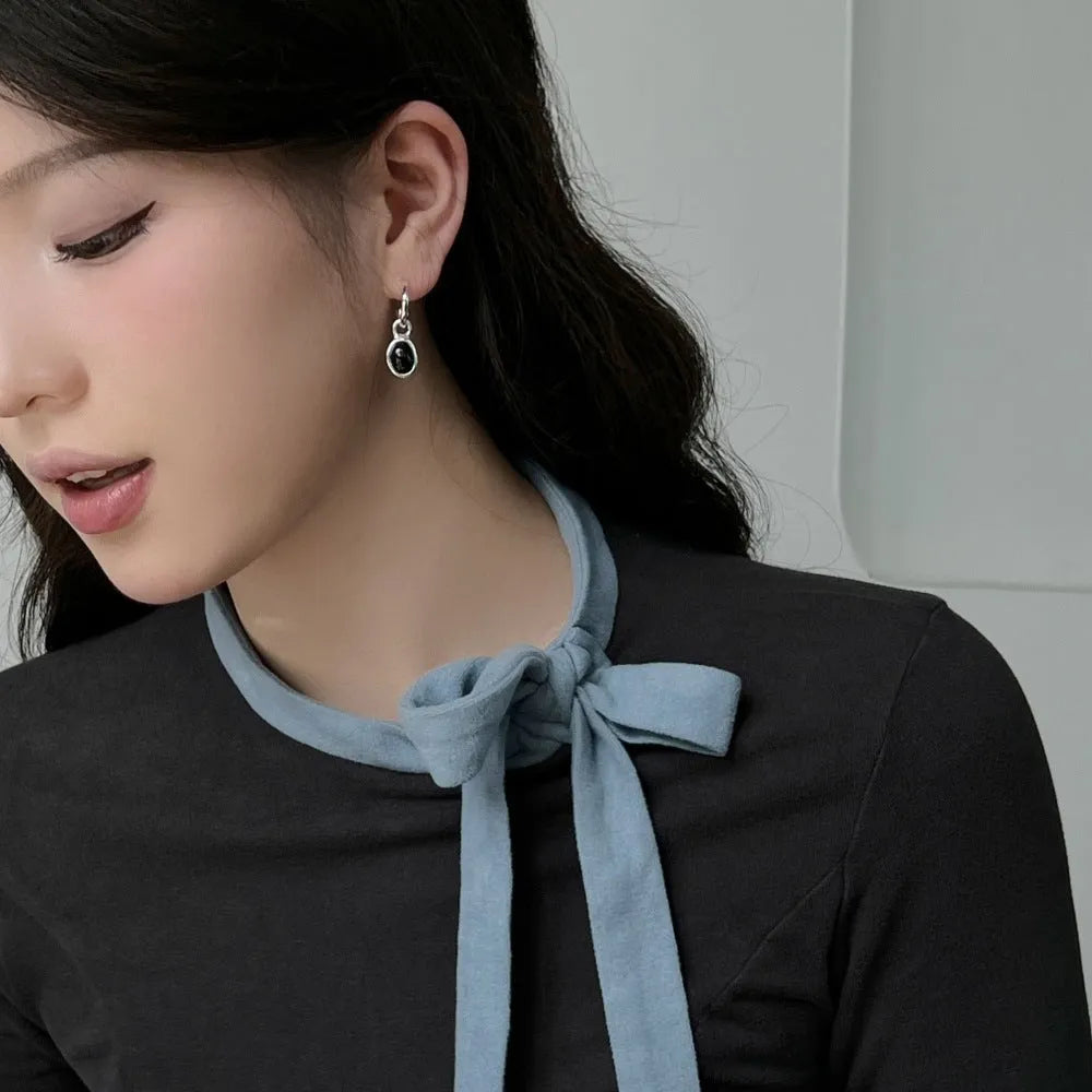 S925 sterling silver stud earrings for women with black agate and a geometric ellipse shape in silver