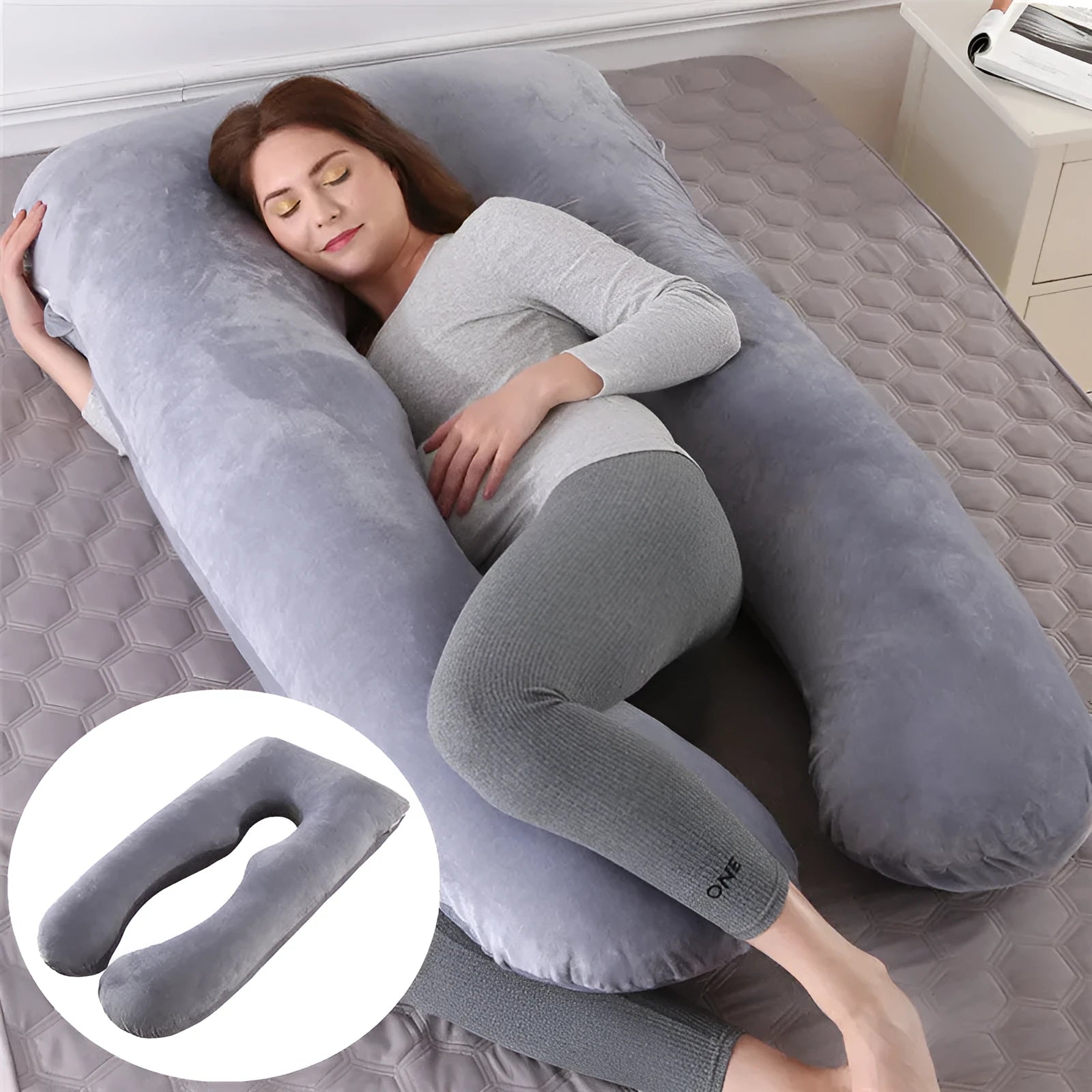 U-shaped white maternity pillow with ice silk cover on a bed, showing its full-body support shape for pregnancy.