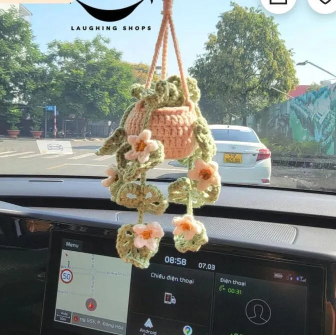 Green and white knitted wool plant ornament for car dashboard with hanging cord