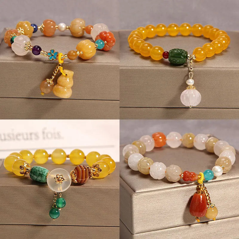 Yellow agate stone bracelet for women with gold silk threading on a wrist