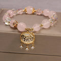 Yellow agate stone bracelet for women with gold silk threading on a wrist