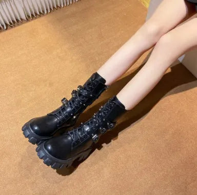 Black women's mid-calf boots with a metal buckle and side zipper on a round toe.