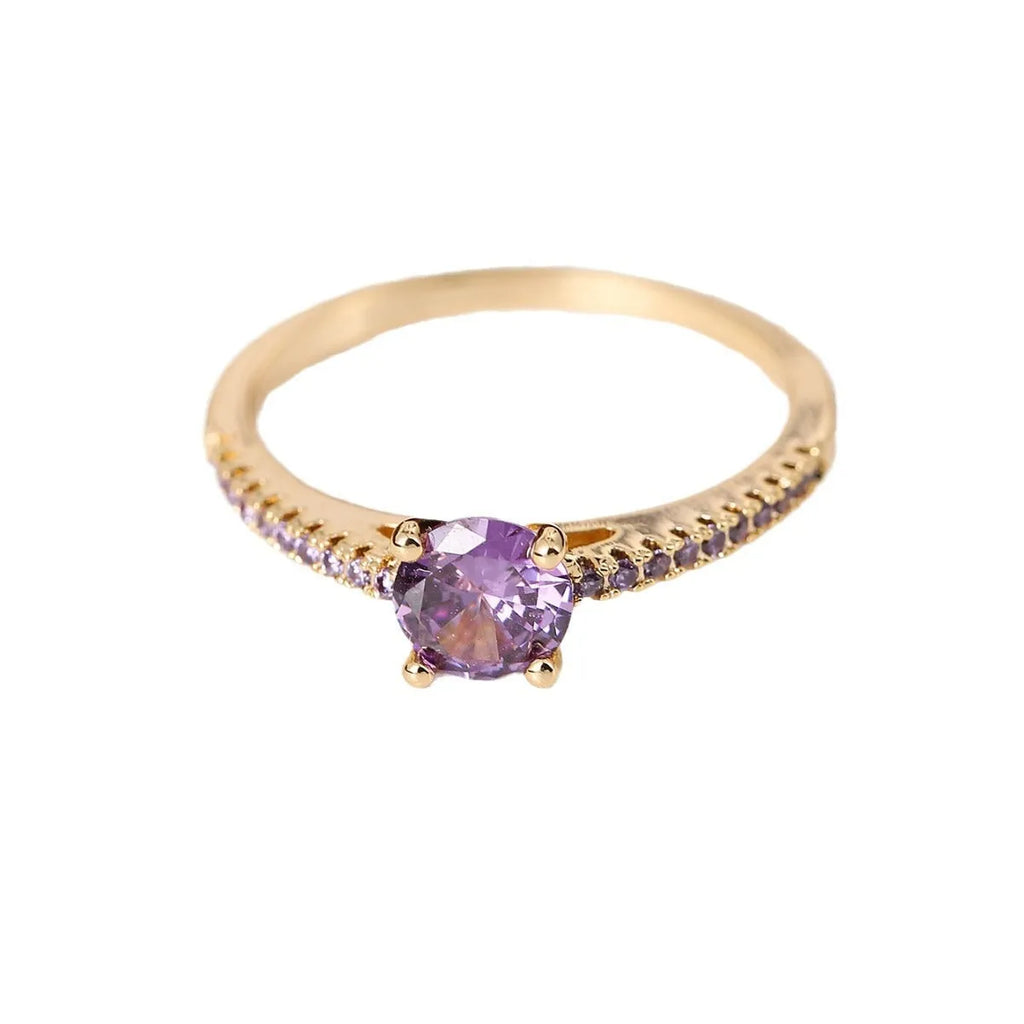 A hexagonal zircon fashion ring made from copper, shown in an electroplated gold rose red finish.