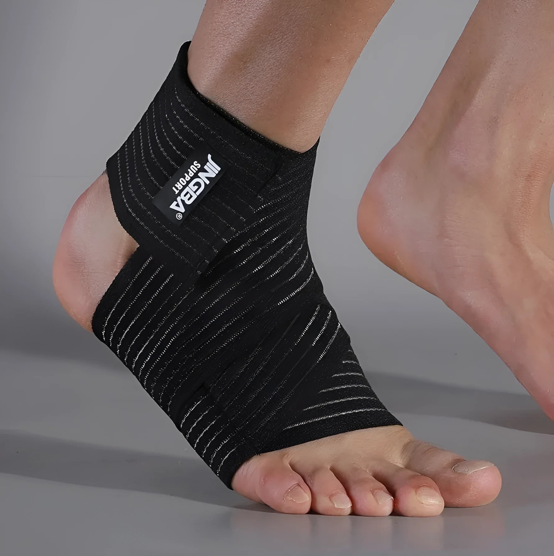 Adjustable black sports ankle support bandage for running, basketball, and athletic activities
