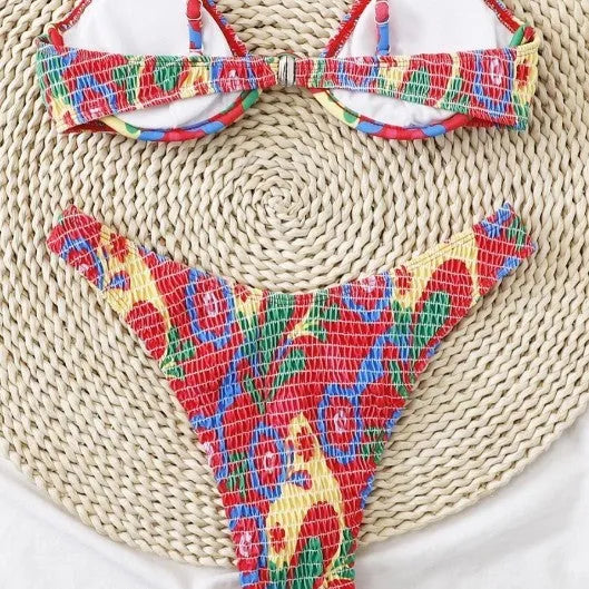 Red floral underwire bikini top and briefs on a white background.