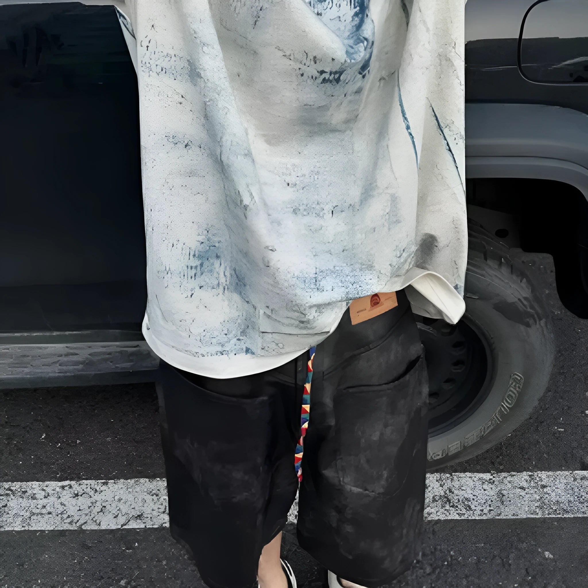 Plain solid colour loose fit t-shirt on a hanger, front view showing round neck and short sleeves.