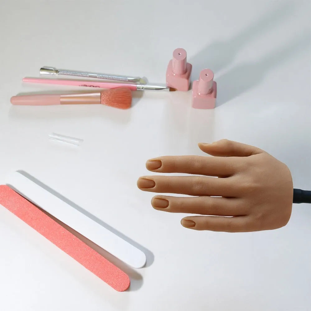 Realistic silicone nail art practice hand model with flexible fingers on a table