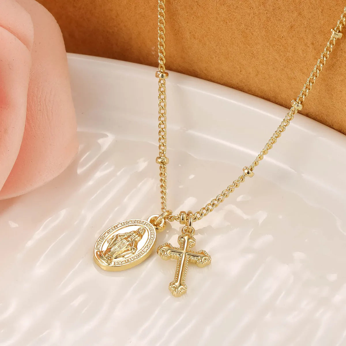 Gold geometric Virgin Mary cross necklace pendant on chain