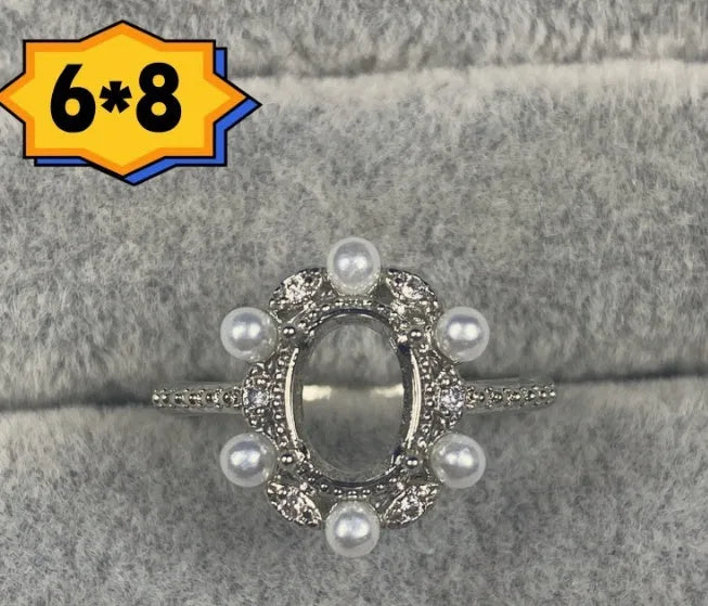 Oval denier ring with 6x8 mm stone and five-pointed star accent on open mouth copper band