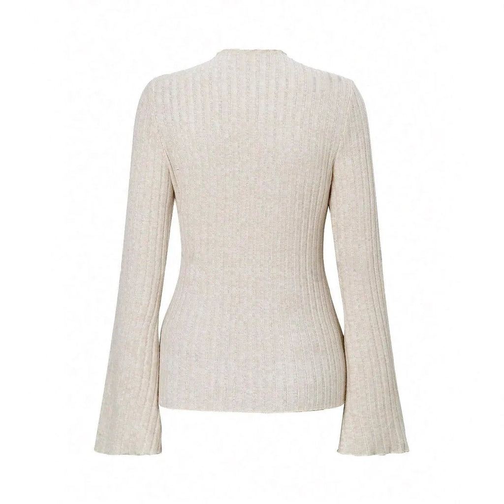A black long sleeve slim fit top with round neck and lantern sleeves on a model.