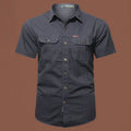Men's short sleeve cotton work shirt in a loose cardigan style, shown in army green colour.