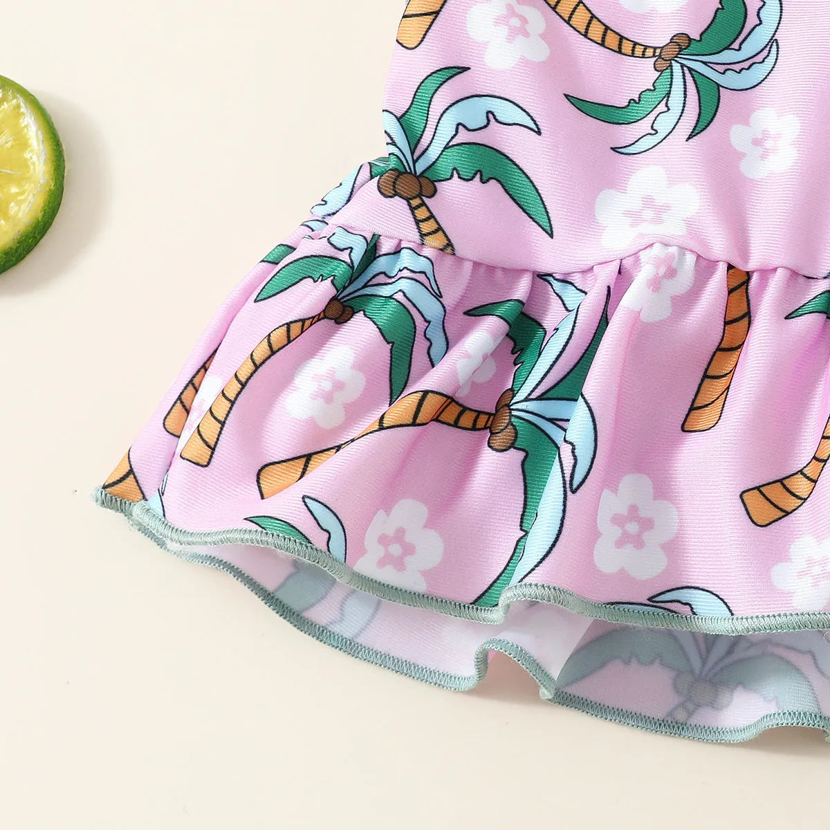 White two-piece baby girl swimsuit set with shirt and shorts for summer beach wear