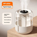 Beige round USB-powered humidifier with dual spray nozzles, display, and night light on a surface.