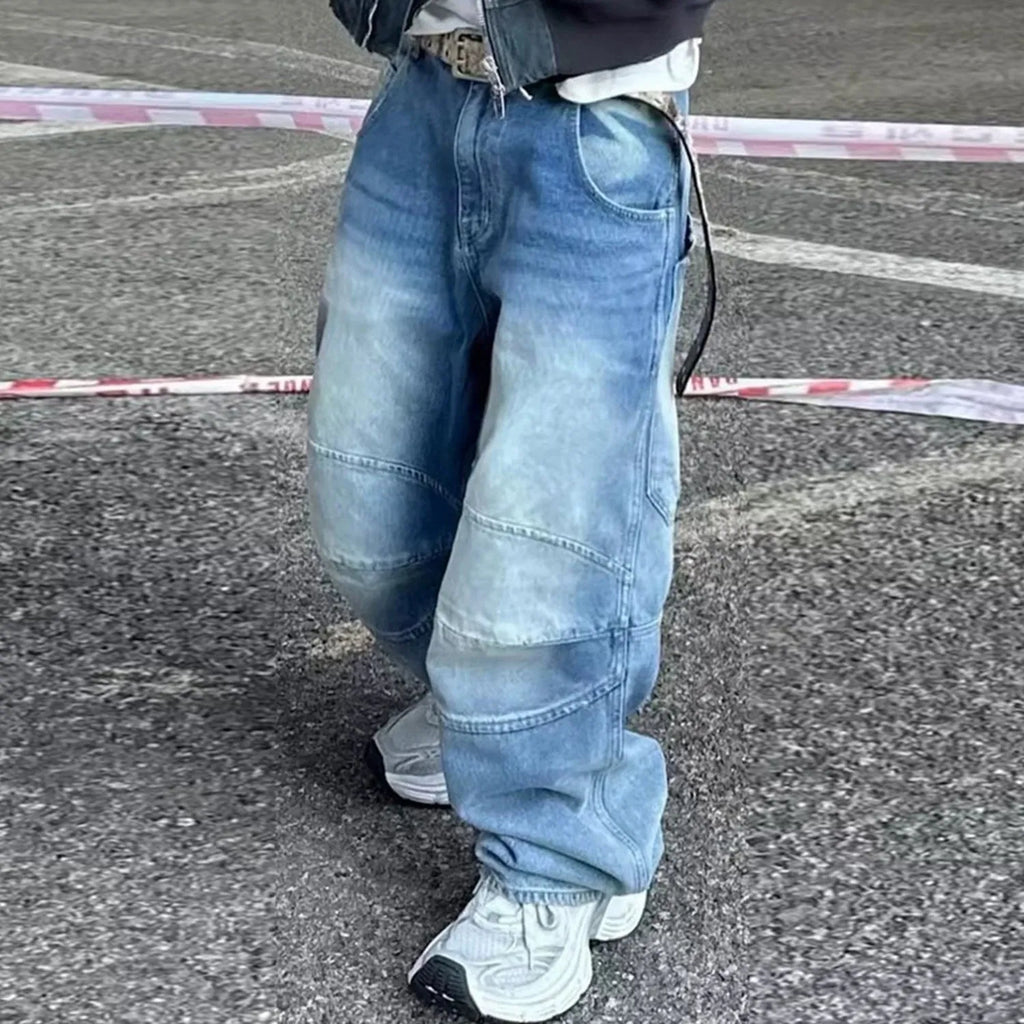 Men's straight leg baggy jeans in a washed blue denim colour with a zip fly.