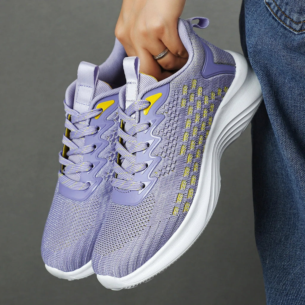 Lavender purple women's Flyknit running shoes with mesh upper and striped pattern on an EVA sole.