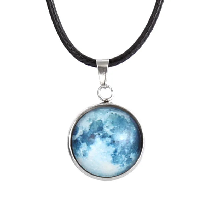 Luminous alloy moon and constellation pendant necklace with a coloured glass cabochon on a chain.
