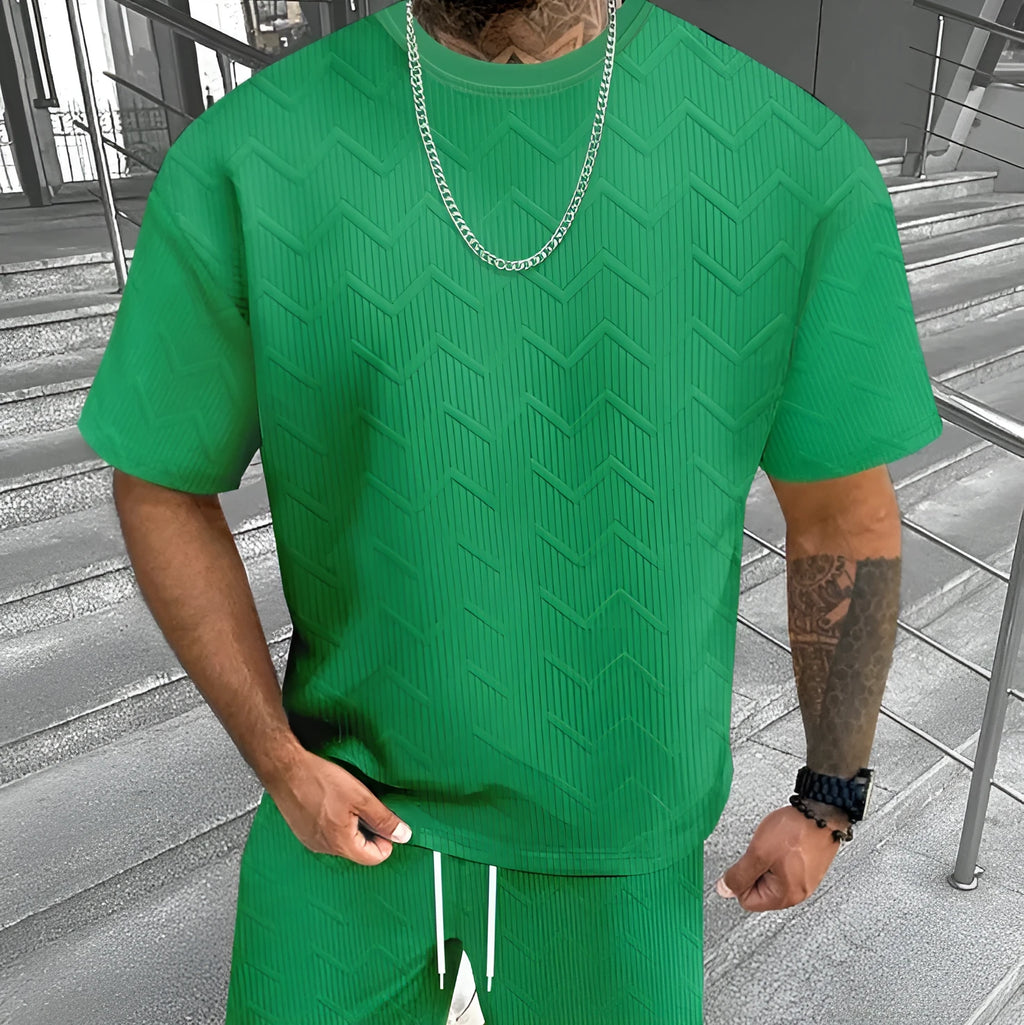 Men's short sleeve top and shorts suit in a printed pattern, shown in a sport leisure style.