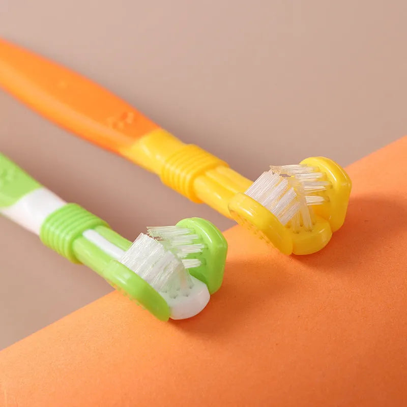 Plastic and nylon pet toothbrush in a sealed bag, colours include orange, green, and blue pink.