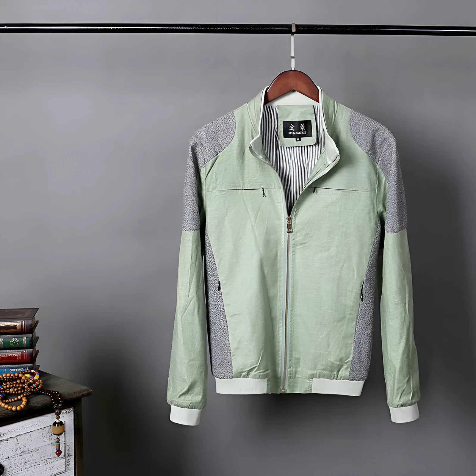 Men's lightweight blue linen jacket with a regular fit, hanging on a hanger.