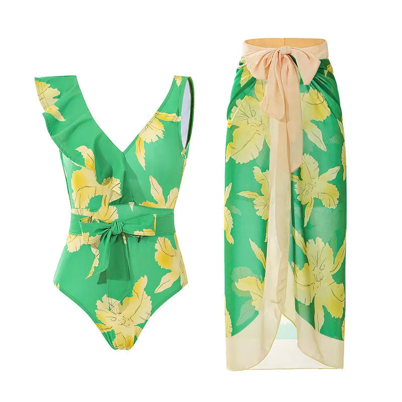 Solid colour women's one-piece swimsuit with thin spaghetti straps and a separate matching swim skirt.