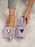 Warm faux fur slippers for women in beige with heart pendant detail and plastic sole