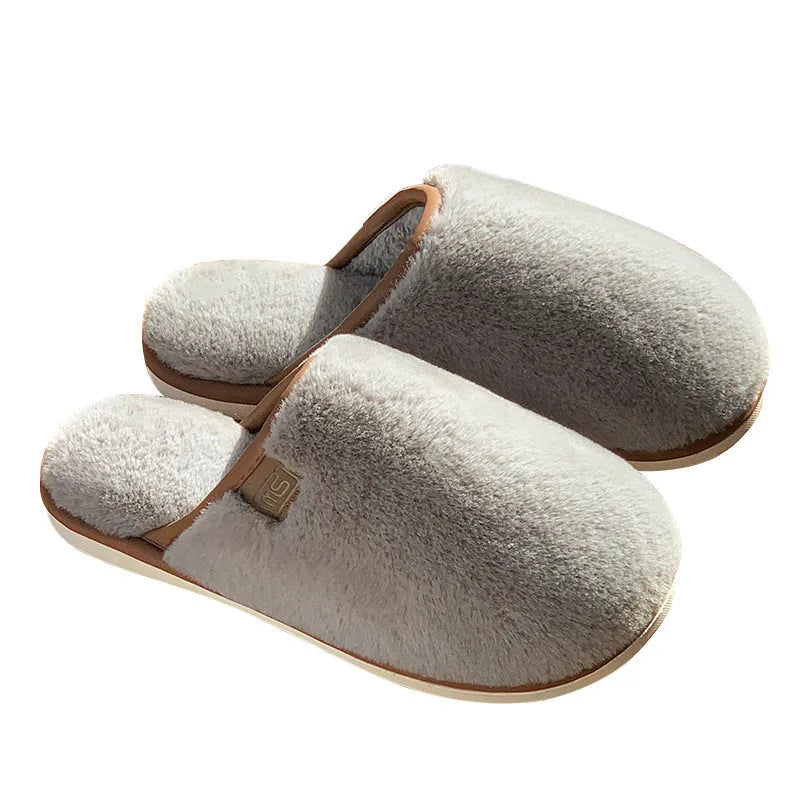 Blue unisex winter plush PVC house slippers with car stitching and a non-slip sole.