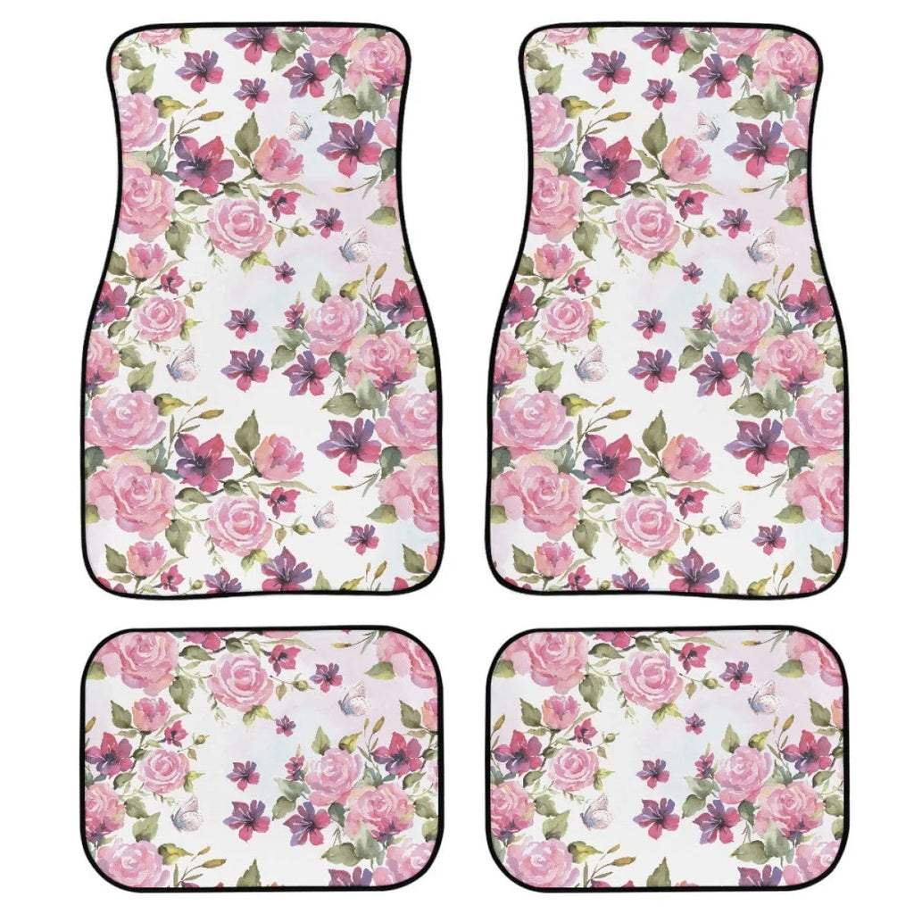 Four-piece set of black printed rubber car floor mats with textured surface.