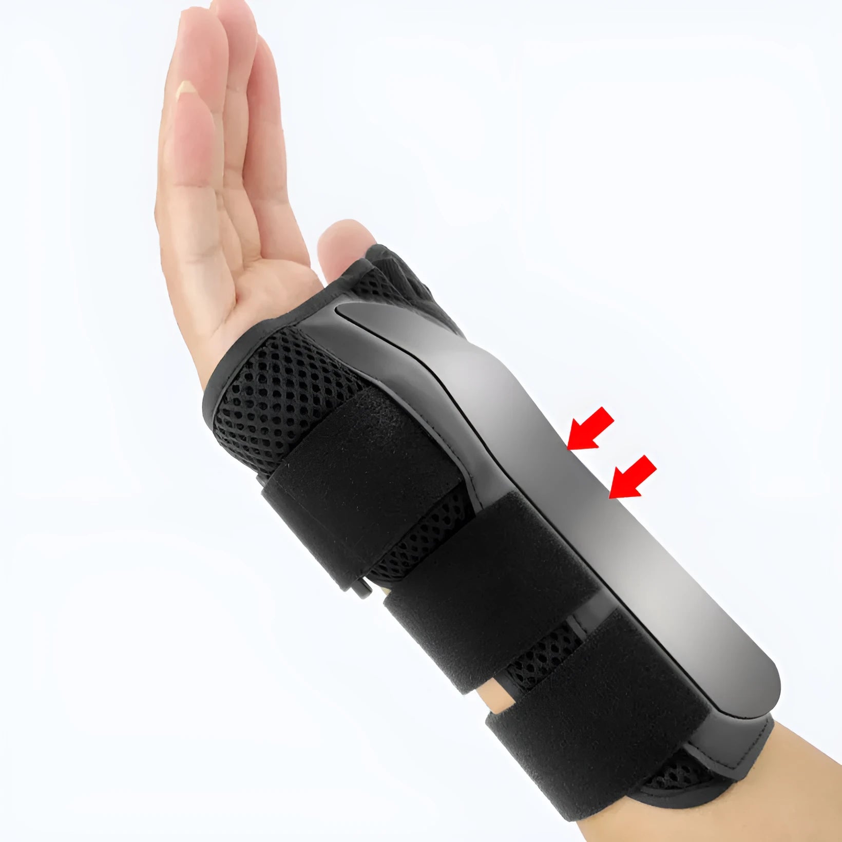 Black carbon fibre sports wrist guard with grey edging and an adjustable thumb strap laid flat.