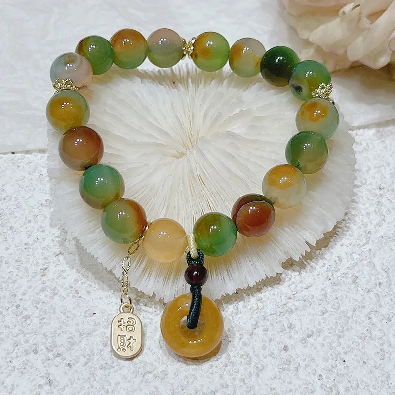 Yellow peacock agate women's bracelet with peace buckle closure measuring 1cm wide