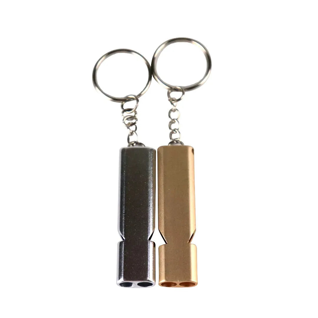 Gold and silver aluminium alloy double-hole survival whistle on a keyring.