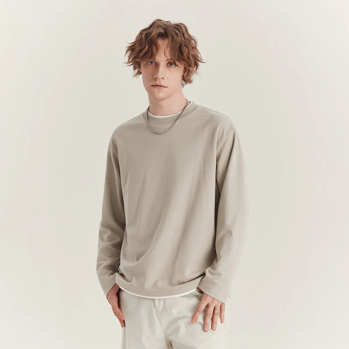Men's loose fit long sleeved cotton blend t-shirt in solid colour on hanger