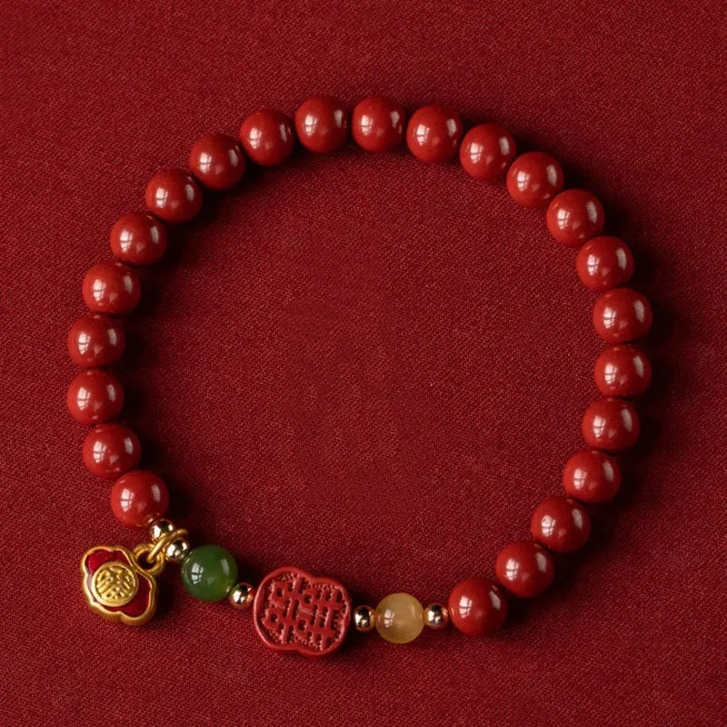 Emperor sandstone cinnabar bracelet with fu charm in 6mm and 8mm bead sizes.