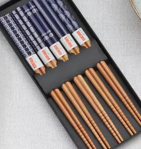 Set of five pairs of bamboo chopsticks with colourful Japanese lucky cat and elegant blue patterns.