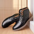Men's brown leather-style ankle boot with a side zip and round toe on a rubber sole.