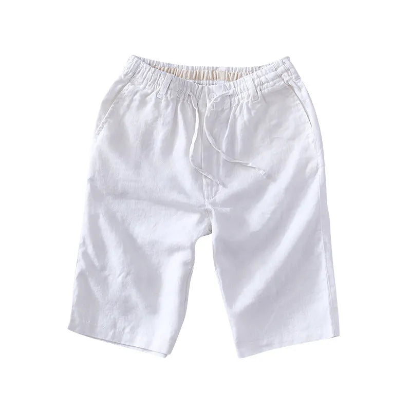 Men's loose-fitting linen capri pants in a light colour, showing the straight-leg style.