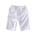 Men's loose-fitting linen capri pants in a light colour, showing the straight-leg style.