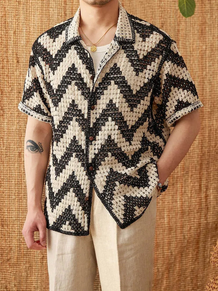 Beach knitted short-sleeved cardigan in black with lapel collar and loose fit on a woman