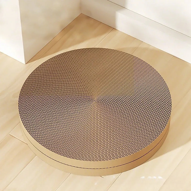 Round green and white corrugated paper cat scratching board and bed, 55cm diameter.