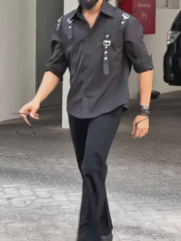 Black men's utility-style button-up shirt with a regular fit on a mannequin.